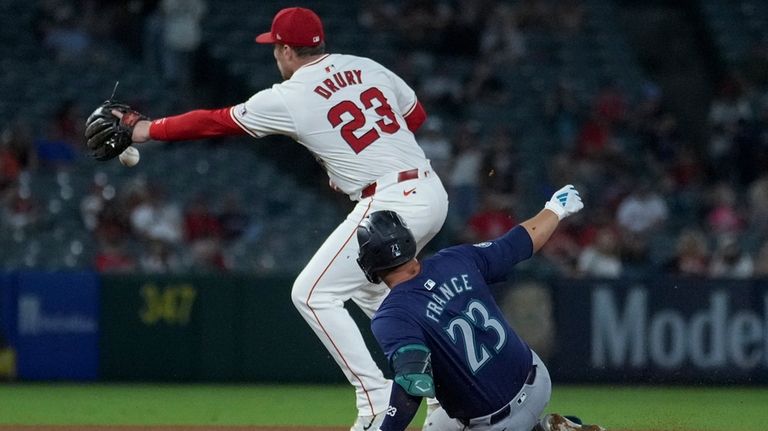 Seattle Mariners' Ty France (23) is forced out on a...