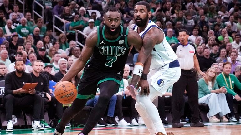 Boston Celtics guard Jaylen Brown (7) drives to the basket...