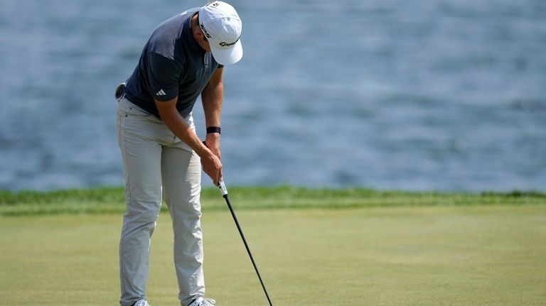 Jacob Bridgeman putts on the 18th green during the first...