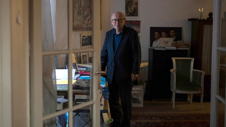 Serge Klarsfeld poses in his office, Tuesday, July 2, 2024...