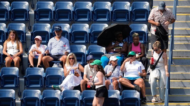 Spectators move to their seats during play between Varvara Gracheva,...