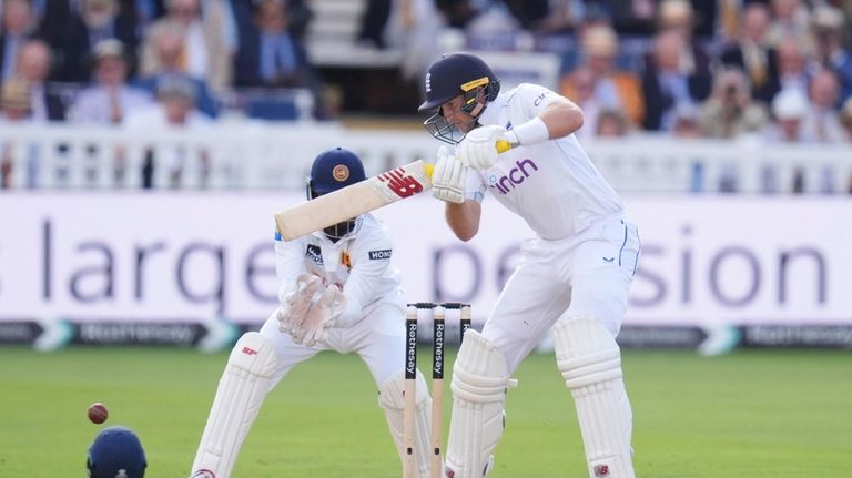 England's Joe Root bats during day one of the second...