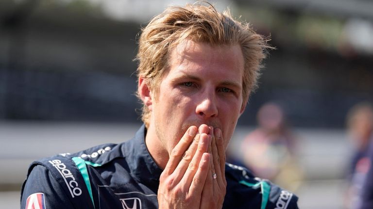 Marcus Ericsson, of Sweden, reacts after qualifying for the Indianapolis...