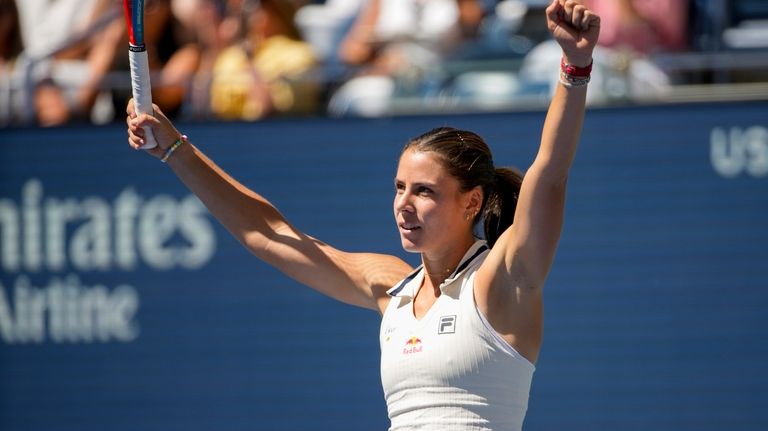 Emma Navarro, of the United States, reacts after defeating Paula...