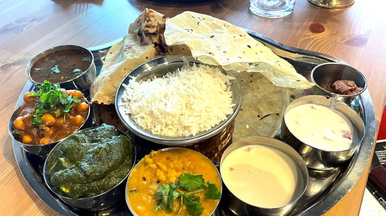 North Indian thali at Village The Soul of India, a...