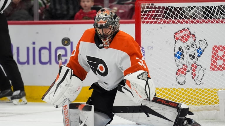 Philadelphia Flyers goaltender Samuel Ersson makes a save against the...