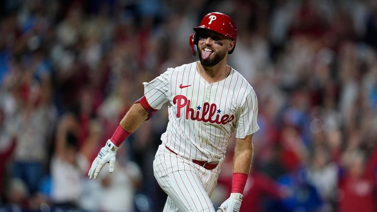 Philadelphia Phillies' Kody Clemens reacts after hitting a walkoff single...