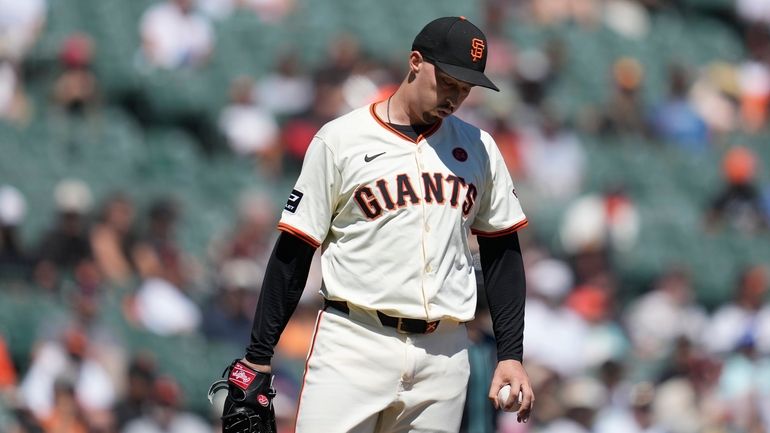 San Francisco Giants pitcher Blake Snell reacts during the first...