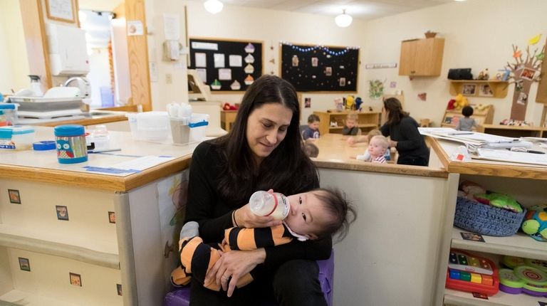 Stefanie Levitz feeds Ollie at Cold Spring Harbor Laboratory's on-site...