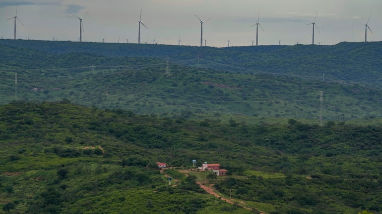 Wind turbines are visible in the distance of Sumidouro, Piaui...
