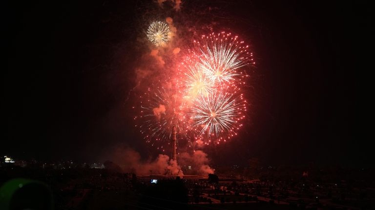 Fireworks light the sky close to the Minar-e-Pakistan or Pakistan...