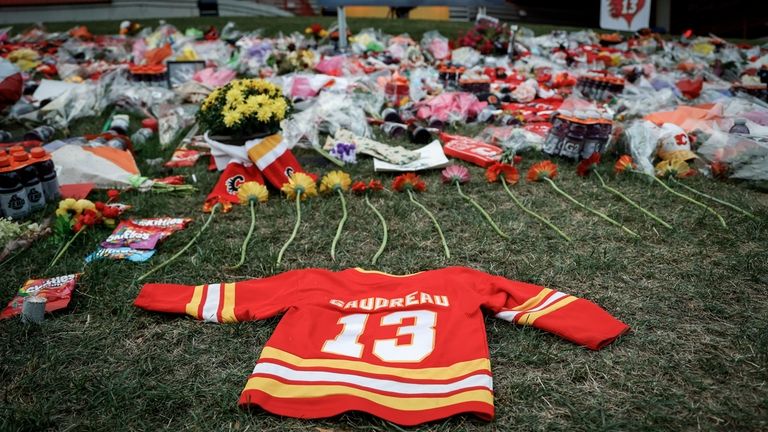 Flowers and memorabilia for former Calgary Flames player Johnny Gaudreau...