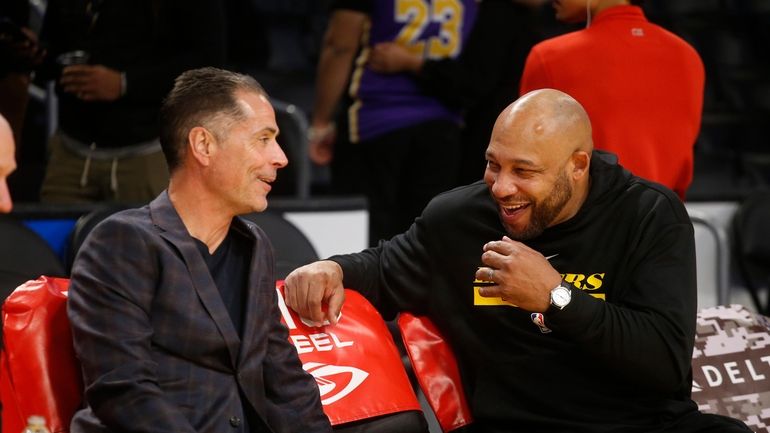 Los Angeles Lakers coach Darvin Ham, right, talks with general...