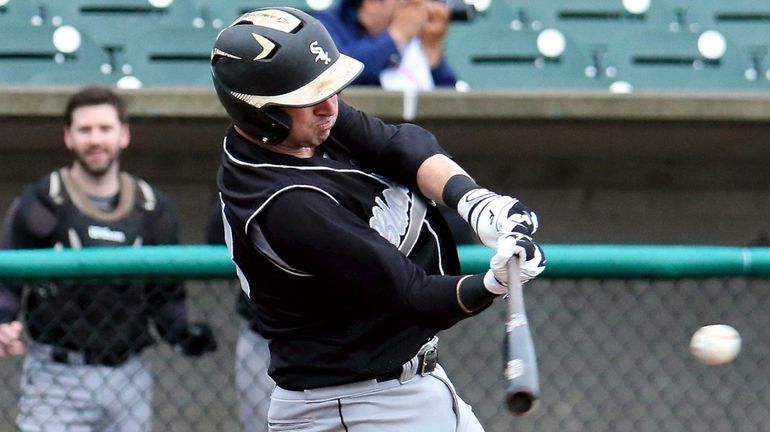 Chris Viscuso of the Long Island Black Sox drives a single...