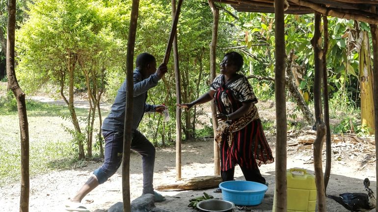 Eva Bulimpikya, right, with Godfrey Tumwesigye, left, in action during...