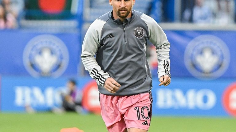 Inter Miami's Lionel Messi runs during warmups for the team's...