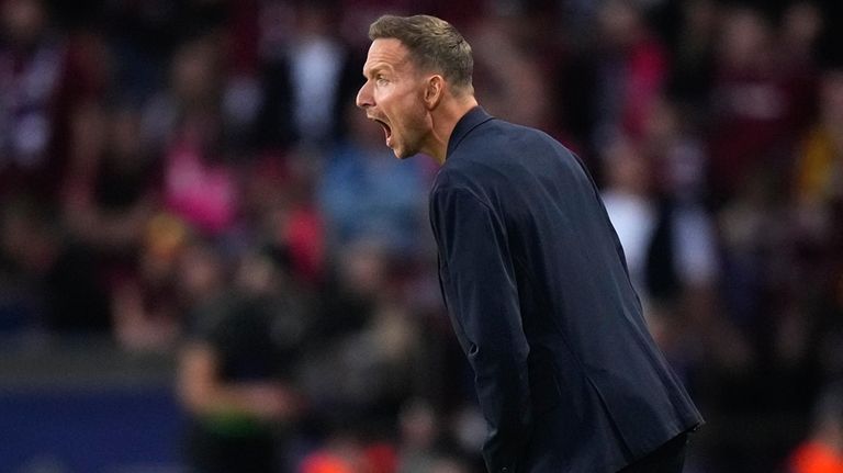 Salzburg's ead coach Pepijn Lijnders shuts from the touchline during...