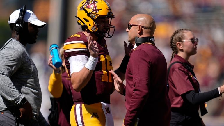 Minnesota quarterback Max Brosmer (16) and head coach P. J....