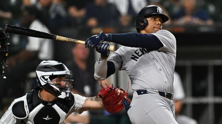 Juan Soto of the Yankees hits a solo home run...