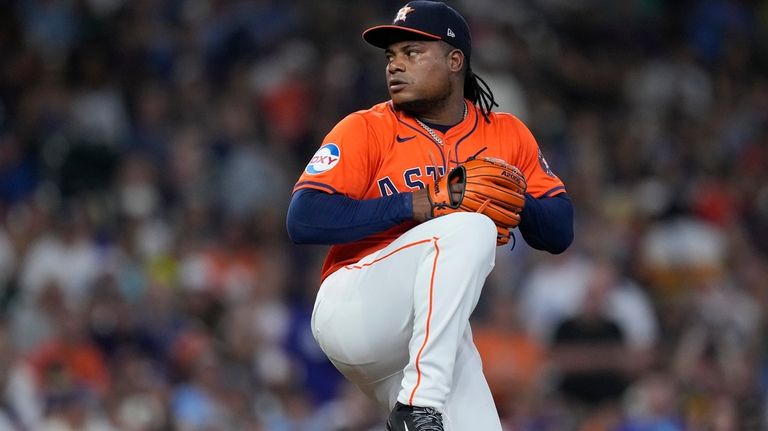 Houston Astros starting pitcher Framber Valdez delivers during the first...