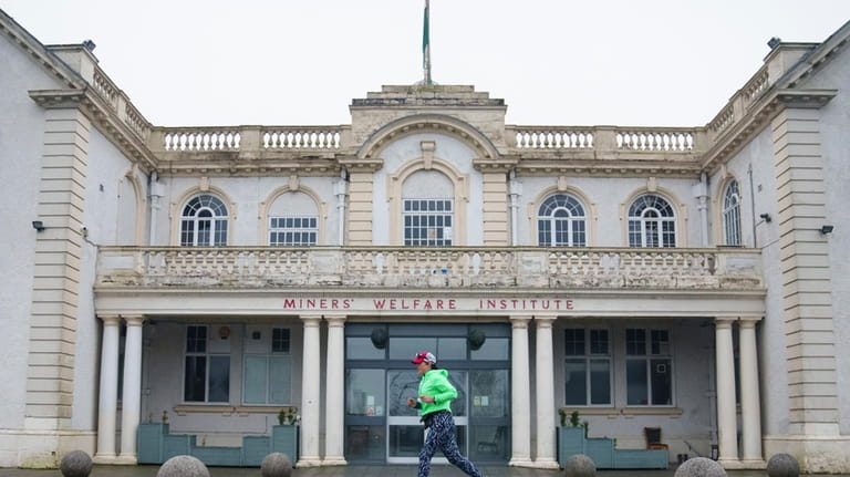 Ultra runner Helen Ryvar passes the Miners' Welfare Institute in...