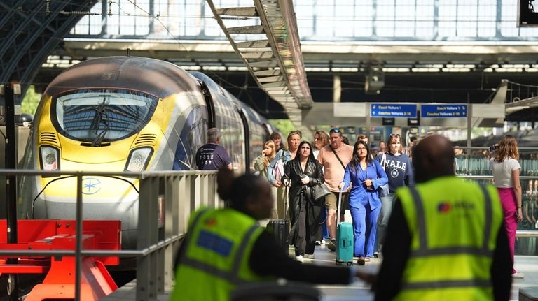 Passengers arrive by train at the Eurostar terminal at St....