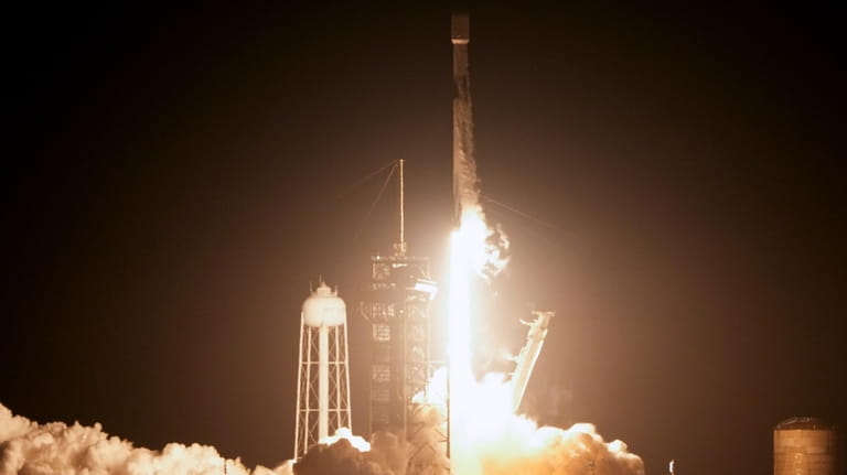 A SpaceX Falcon 9 rocket lifts off from pad 39A...