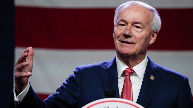 Republican presidential candidate and former Arkansas Gov. Asa Hutchinson speaks...