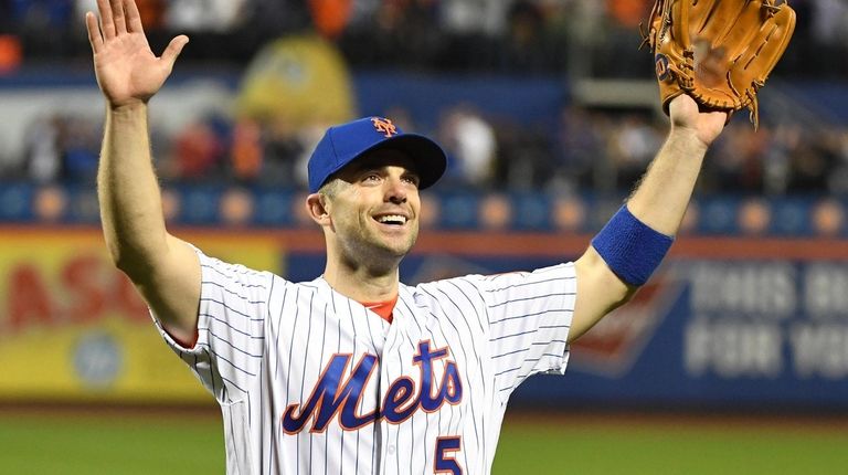 New York Mets third baseman David Wright reacts as he...