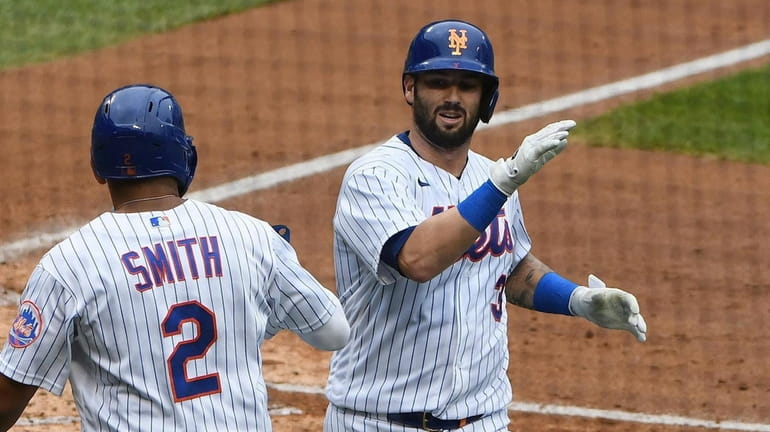 Mets catcher Tomas Nido celebrates his two-run home run with...