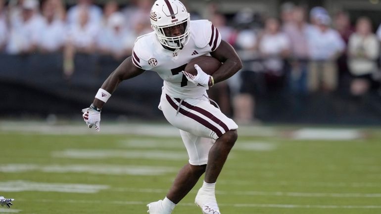 Mississippi State running back Jo'Quavious Marks runs for a first...