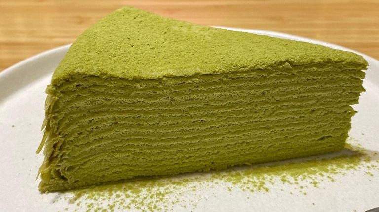 The matcha crepe cake is made from delicate layers of...