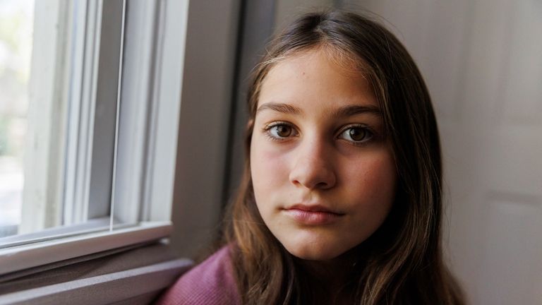 Scarlett Goddard Strahan, 11, poses for a portrait at her...