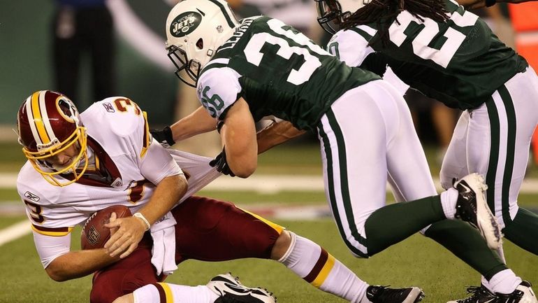 Jim Leonhard #36 of the New York Jets sacks John...