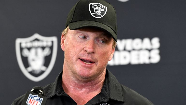 Las Vegas Raiders head coach Jon Gruden speaks with the...