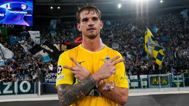 Lazio's goalkeeper Ivan Provedel celebrates at the end of a...