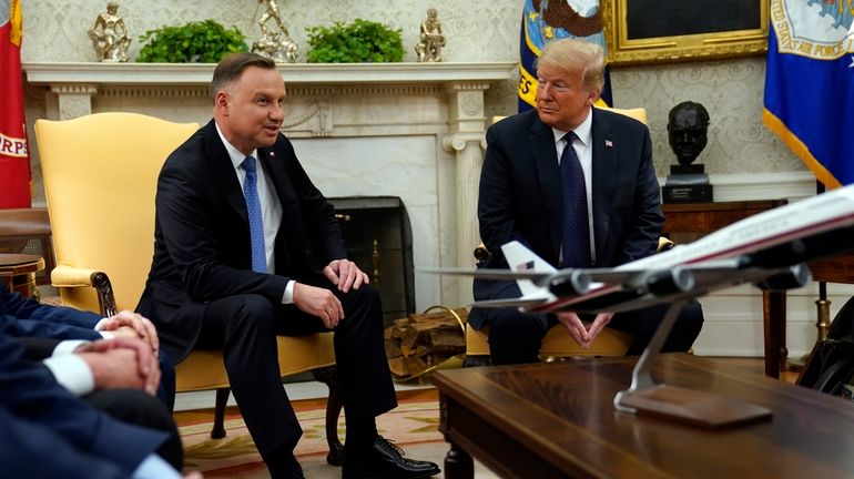 Then-President Donald Trump meets with Polish President Andrzej Duda in...