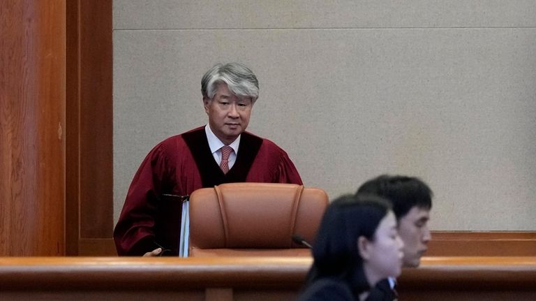 South Korea's Constitutional Court Chief Justice Lee Jong-seok arrives at...