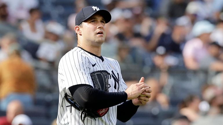 Tommy Kahnle #41 of the New York Yankees reacts after...