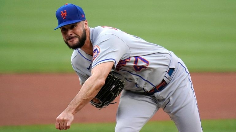 Mets starting pitcher Joey Lucchesi throws during the first inning...