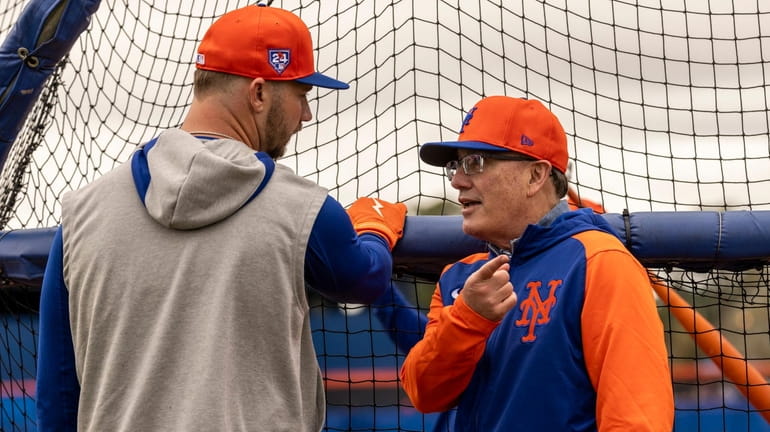 Mets owner Steve Cohen talks to Pete Alonso during a spring training...