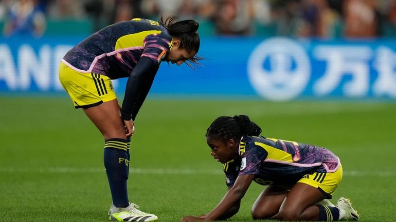 Colombia's Linda Caicedo, right, is injured as Colombia's Manuela Vanegas...