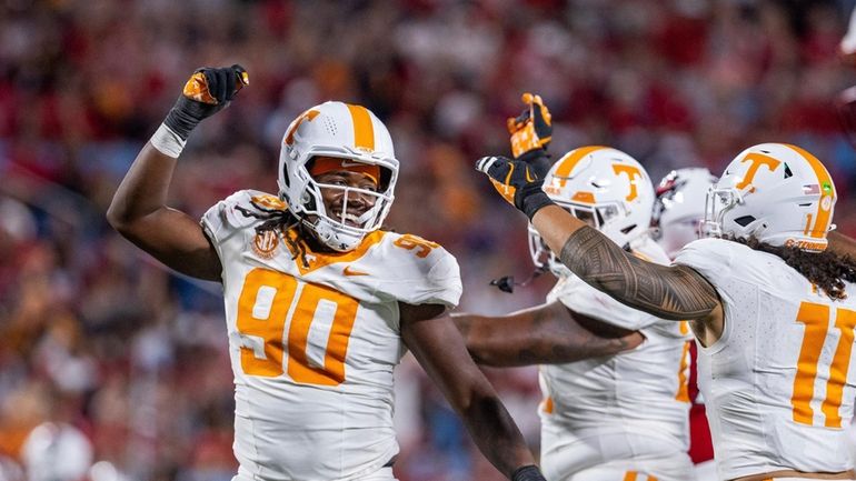 Tennessee defensive lineman Dominic Bailey (90) celebrates during the second...