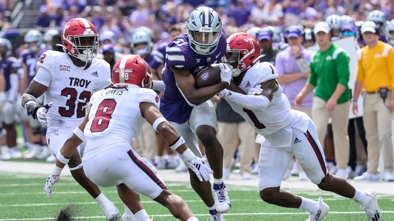 Kansas State running back DJ Giddens (31) is tackled by...