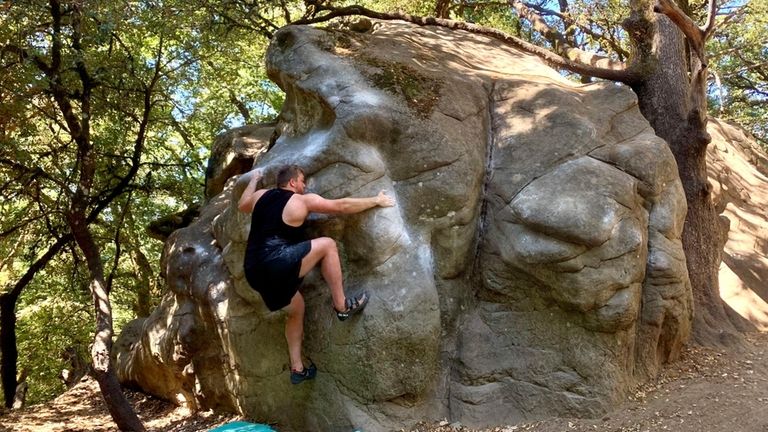 Jets offensive lineman Wes Schweitzer climbs Castle Rock in Castle...