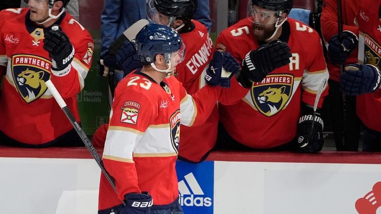 Florida Panthers center Carter Verhaeghe (23) is congratulated by his...