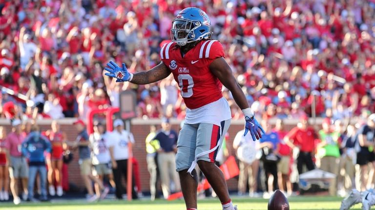 Mississippi running back Matt Jones (0) reacts after scoring a...