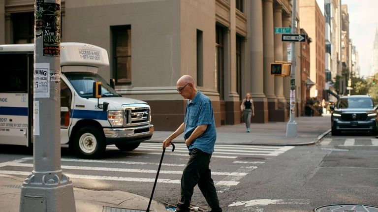 Ron Spitzer, a stroke survivor, walks to his music therapy...