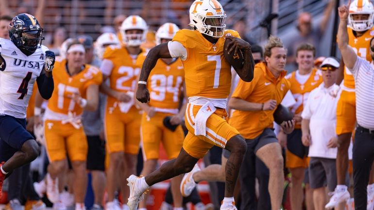 Tennessee quarterback Joe Milton III (7) outruns the UTSA defense...