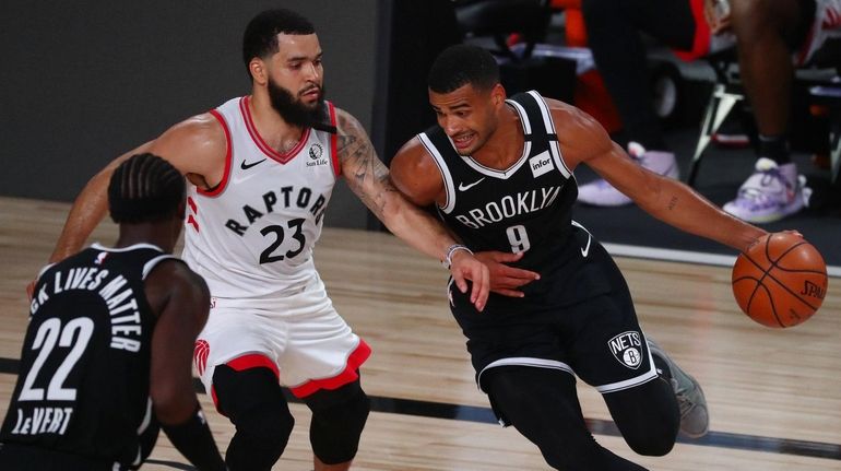 Timothe Luwawu-Cabarrot #9 of the Brooklyn Nets moves the ball...